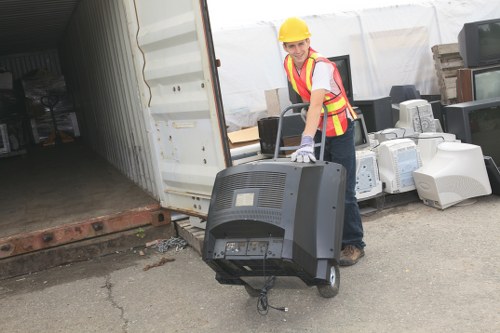 Community members assisting in furniture donation efforts